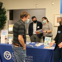 Faculty discusses with faculty